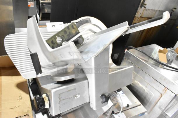 Bizerba metal commercial countertop meat slicer on stainless steel stand, 115V, 1 phase. Features adjustment knob and safety guard.