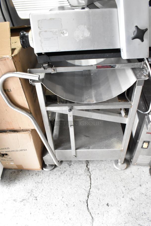 Bizerba metal commercial meat slicer on stainless steel stand, 115 volts, 1 phase, with adjustable knobs, on wheels.
