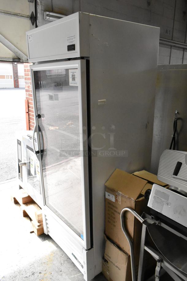 2021 True TSCI-600R-G-PH metal single door reach-in cooler with glass door, poly coated racks. 115V, 1 phase. Used condition.