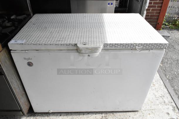 Whirlpool WZC3115DW00 metal chest freezer, 115 volts, 1 phase, visible wear, hexagonal pattern top.