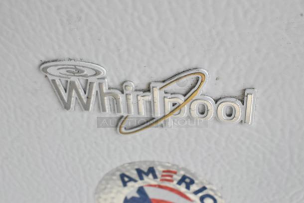 Whirlpool WZC3115DW00 chest freezer logo detail on white surface.