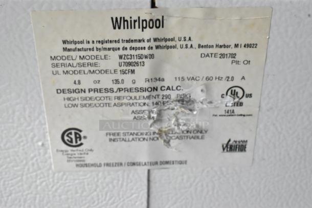 Whirlpool WZC3115DW00 chest freezer label showing model, UL certification, voltage info; some label wear visible.