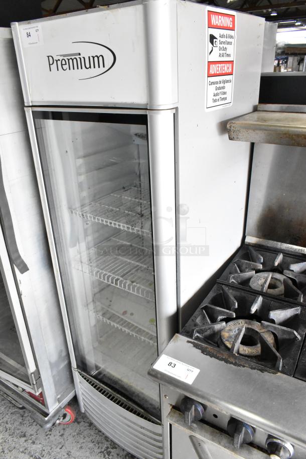 Premium PRF90DX metal single door reach-in cooler merchandiser with poly-coated racks, 115 volts, 1 phase, good condition.