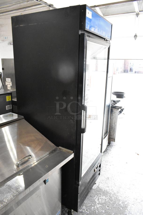EGDM-29B metal single door cooler merchandiser on casters, poly-coated racks, 115V, used condition, commercial use.