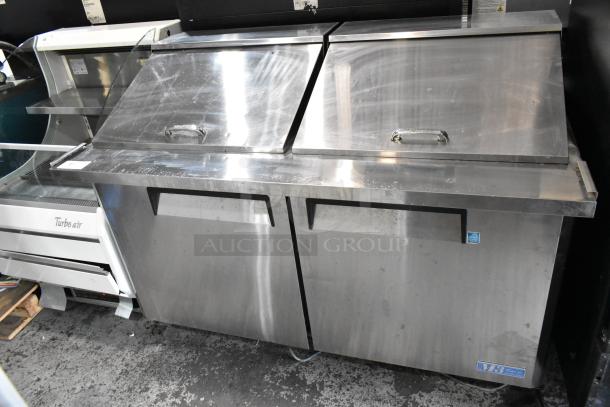 Turbo Air MST-60-24 metal commercial prep table with dual lids, mega top, and casters. 115V, 1 Phase. Good condition.