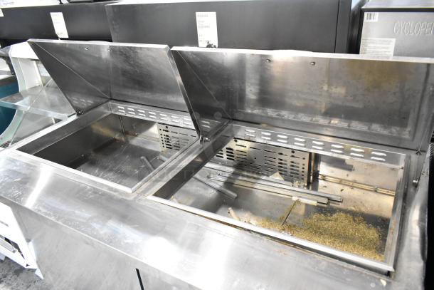 Turbo Air MST-60-24 prep table with dual compartments, metal finish, commercial casters, 115V, visible wear.