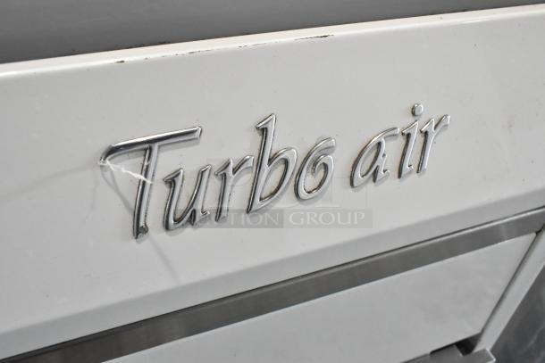 Turbo Air TOM-30L(W) metal commercial merchandiser with visible logo, 120 volts, 1 phase, minor surface wear.