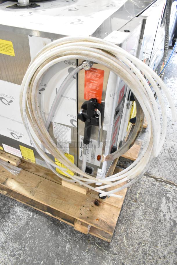 Brand new Convotherm OES-6.10 stainless steel commercial combi oven on pallet, 208/240V, 3-phase, with hoses attached.