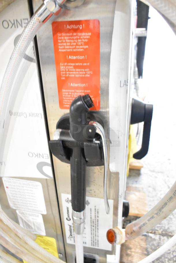 BRAND NEW Convotherm OES-6.10 combi convection oven, 208/240V, 3 phase. Visible caution labels and hoses attached.