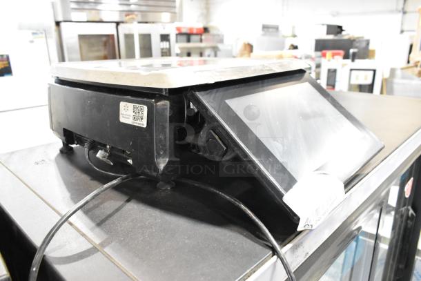 2016 Hobart HTi Metal Commercial Countertop Food Portioning Scale, 120/208-240 Volts, 1 Phase, with touchscreen display.