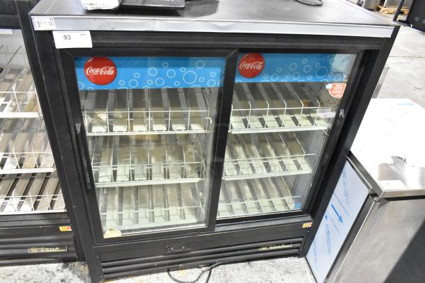 True GDM-41SL-54EM-LD commercial cooler, 2 glass doors, metal with poly-coated racks, and Coca-Cola branding.