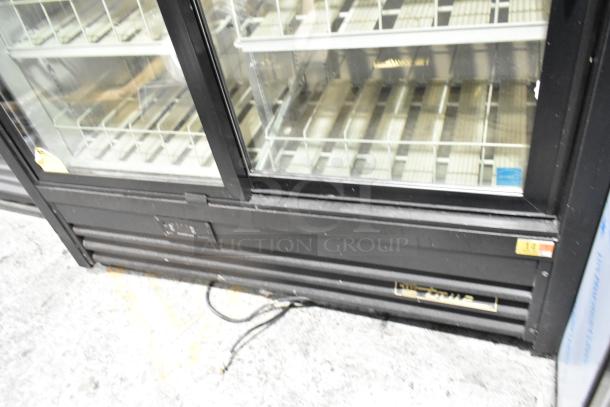 True GDM-41SL-54EM-LD commercial cooler, metal, 2 glass doors, poly coated racks, visible tags, 115V, 1 phase.