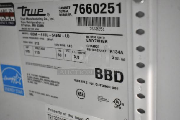 True GDM-41SL-54EM-LD metal cooler tag showing model, serial number 7660251, Energy Star, and 115V specs.