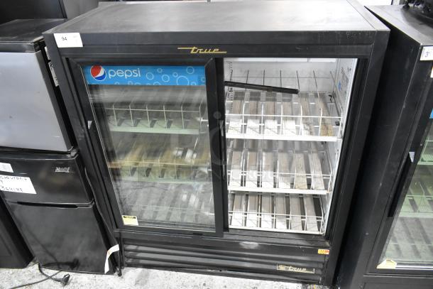 True GDM-41SL-54-LD commercial cooler with two glass doors and poly-coated racks, 115 volts, in good condition.