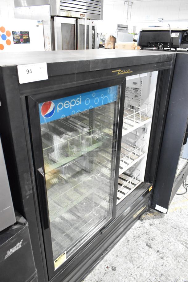 True GDM-41SL-54-LD cooler merchandiser, 2 glass doors, poly-coated racks, 115V, Pepsi branding, good condition.