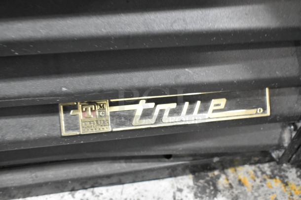 True GDM-41SL-54-LD 2 Door Cooler Merchandiser, metal, poly-coated racks, 115 volts, 1 phase, brand label visible.