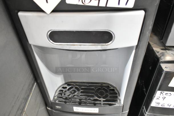 2020 Follett 15CI100A metal commercial countertop ice machine and water dispenser, 115 volts, 1 phase, labeled "quench."