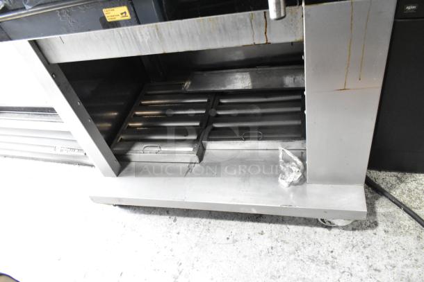 Fri-jado TDR7-P stainless steel electric rotisserie oven on casters, 208V, 3 phase, visible signs of use.