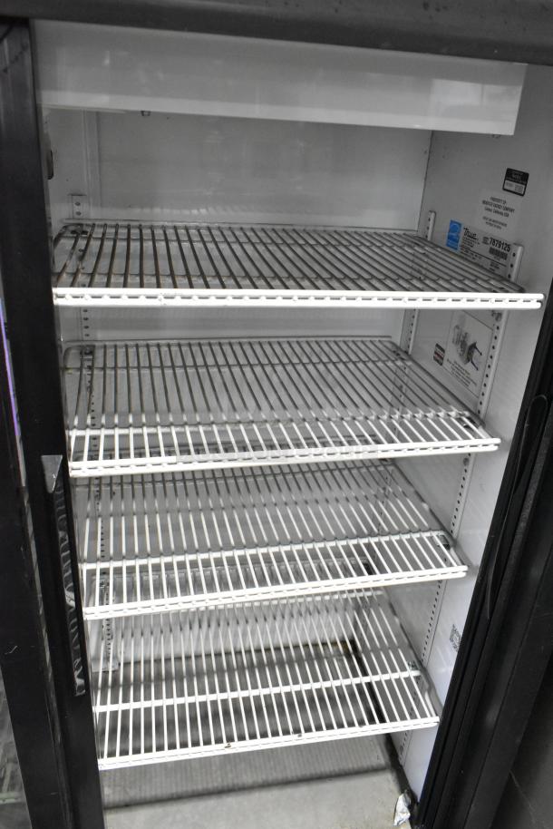 True GDM-41SL-60-LD commercial cooler with two glass doors, poly-coated racks, in used condition. Model, voltage labels visible.