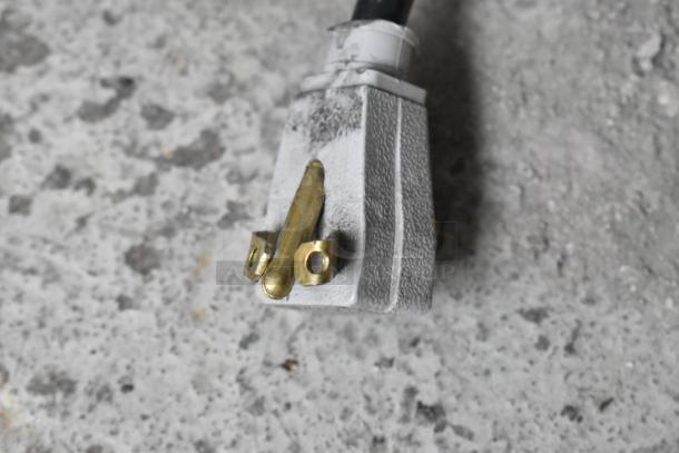 Close-up of True GDM-41SL-60-LD cooler's power plug, highlighting three-prong design for 115V, 1-phase connection.