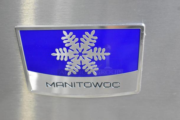 Manitowoc D970 stainless steel commercial ice bin, 48" width, 882 lbs capacity, features a prominent logo and sturdy design.