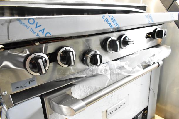 BRAND NEW Garland 372G366CN stainless steel 6-burner range with convection oven, over shelf, and backsplash, 236,000 BTU.