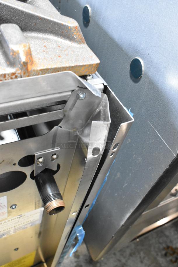 BRAND NEW Garland 372G366CN 6 Burner Range showing a metal section with visible scratch, highlighting scratch and dent condition.
