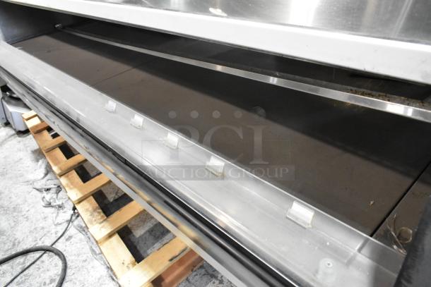 Custom Deli's metal commercial floor warming display case merchandiser, large capacity, sturdy structure, good condition.