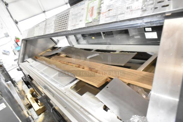 Custom Deli's metal commercial floor-style warming display case merchandiser, featuring a sleek design and labeling.