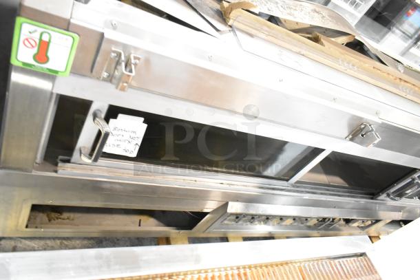Commercial warming display case by Custom Deli's, metal construction, floor style, visible note indicates bottom issue, fair condition.