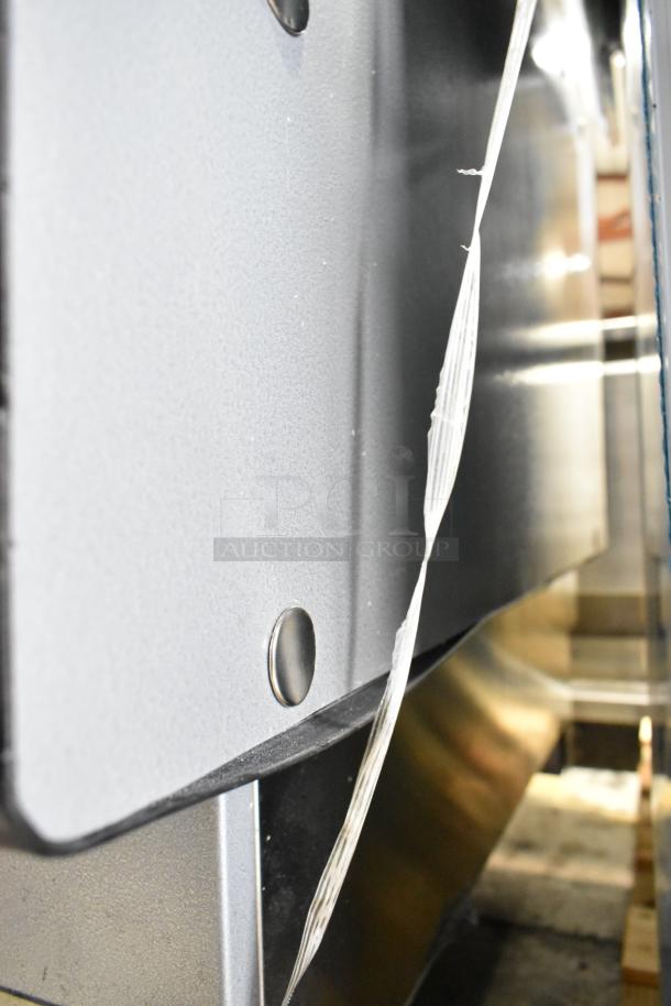 Custom Deli's metal commercial warming display case, shown in partial side view. Features sturdy metal construction, condition appears intact.