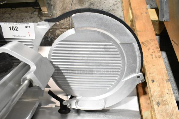 2019 Bizerba GSP H metal commercial meat slicer, 115 volts, 1 phase, shown in used condition, visible auction tag.