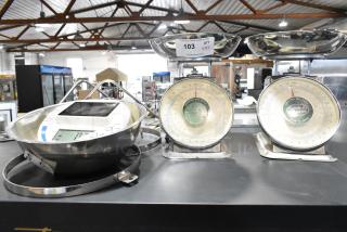 Three various scales, including a Detecto SCS30 digital scale and two Universal Dial scales, with metal trays, in used condition.