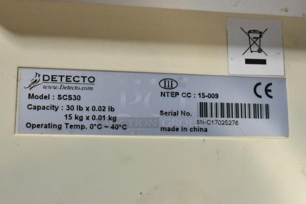 Detecto SCS30 scale label; capacity 30 lb x 0.02 lb or 15 kg x 0.01 kg; operating temp 0°C-40°C; made in China.