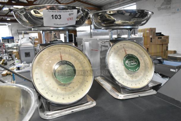 Three metal scales, including Detecto SCS30 and two Universal Dial Scales, visible markings and dials, used condition.