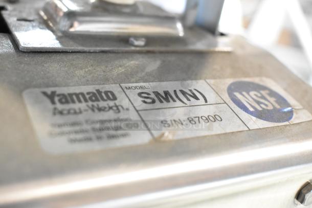 Close-up of a Yamato Accu-Weigh scale model SM(N) with NSF marking and serial number 87900, showing good condition.