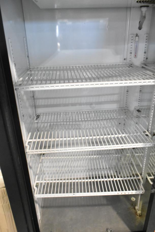 2019 True GDM-41SL-60-LD commercial 2-door cooler with poly-coated racks, 115 volts, 1 phase, in good condition.