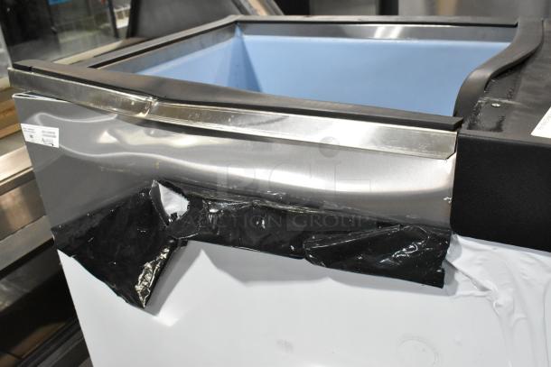 Brand new Avantco 194BIN40022 ice storage bin, 383 lb capacity, metallic alloy exterior with visible dents. Model label present.