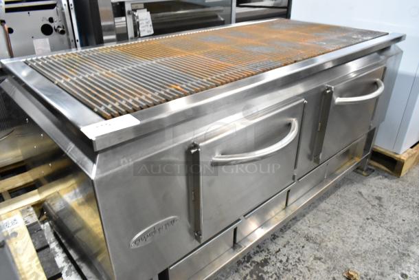BRAND NEW Champion Tuff 782TG60 stainless steel 60" wood burning grill, with minor scratches and dents, dual doors, and a spacious grilling surface.