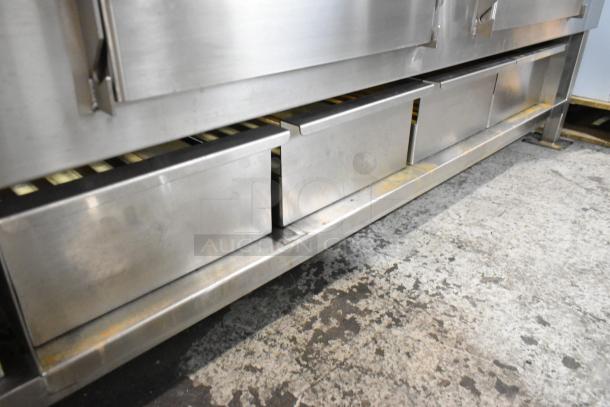 Brand new Champion Tuff 782TG60 stainless steel 60" wood burning grill, scratch and dent condition, high durability.