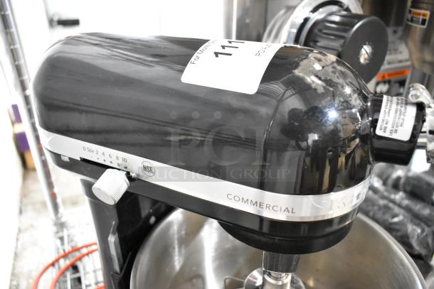 Brand new KitchenAid KSM8990OB black 8 Qt mixer. Includes metal bowl, paddle, whisk, dough hook. Visible scratch. 115V.