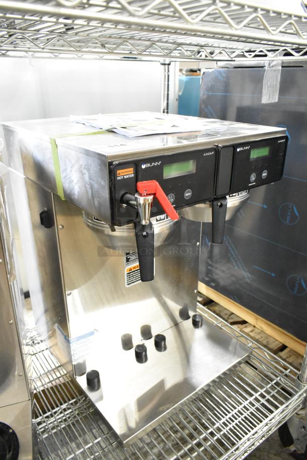 Brand new Bunn AXIOM TWIN APS twin airpot coffee brewer, with hot water dispenser and two metal brew baskets.