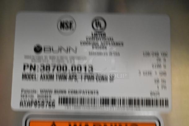 Label on Bunn AXIOM TWIN APS coffee brewer, showing model number 38700.0013, NSF and UL certifications.