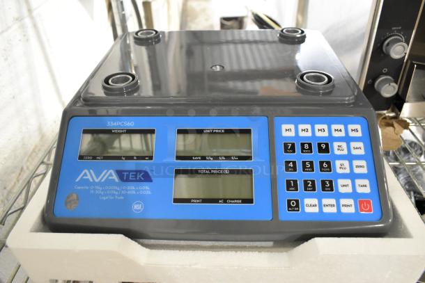 Brand new AvaTek 334PCS60 digital price computing scale, 60 lb. capacity, minor scratches, integrated keypad, three display panels.