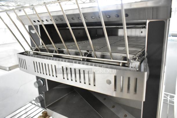 Brand new Vollrath CT2-120350 JT1 Conveyor Toaster, 1.5" opening, 120V, 1 phase. Visible stainless steel build, minor dents.