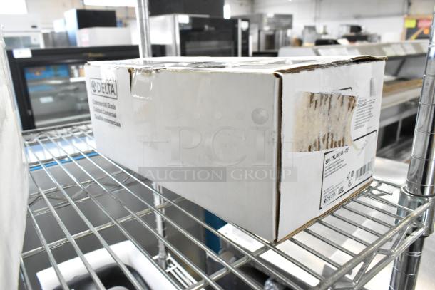 Box containing Delta Faucet models 590-PALGHDF, 2564-SSMPU-DST, 591-TFLGHGMHDF. New condition, scratch and dent marked.