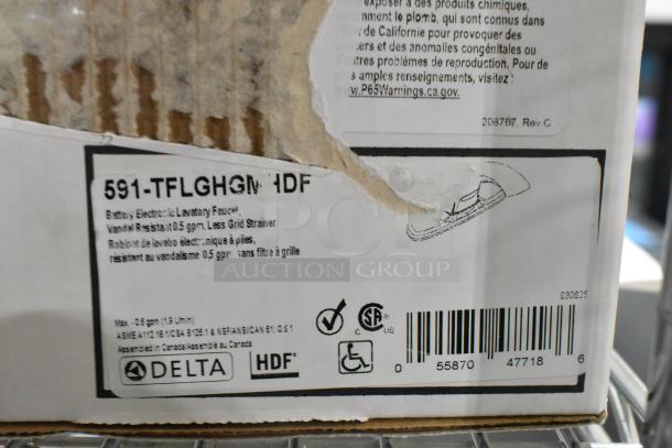 Delta Faucet box with label showing model 591-TFLGHGMHDF, electronic lavatory faucet, 0.5 GPM, vandal-resistant.