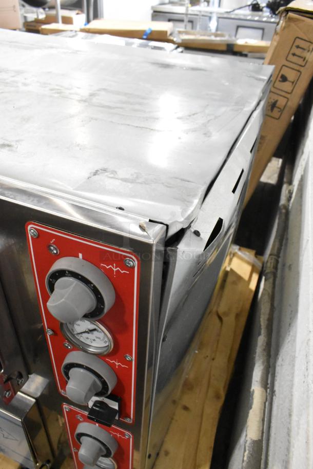 Brand new Trento 2-deck stainless steel pizza oven; scratch and dent condition, electric, with cooking stones, 230V.