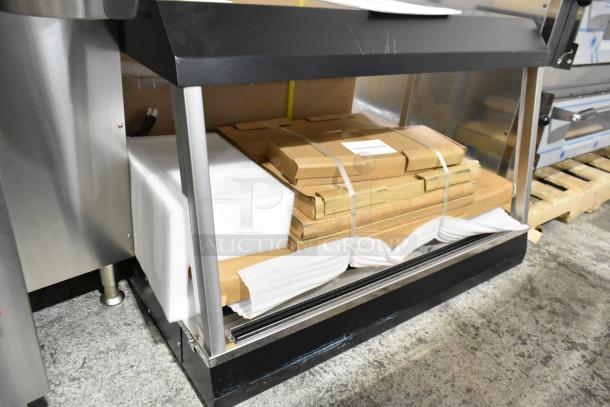 Brand new Vollrath FMA7036 36" Hot Food Merchandiser, scratch and dent condition. 120V, 1 Phase, packaging visible.