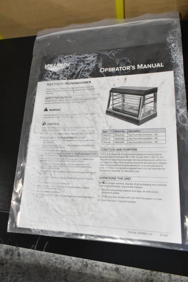 Operator's manual for Vollrath FMA7036 Hot Food Merchandiser, showing product image and safety instructions.